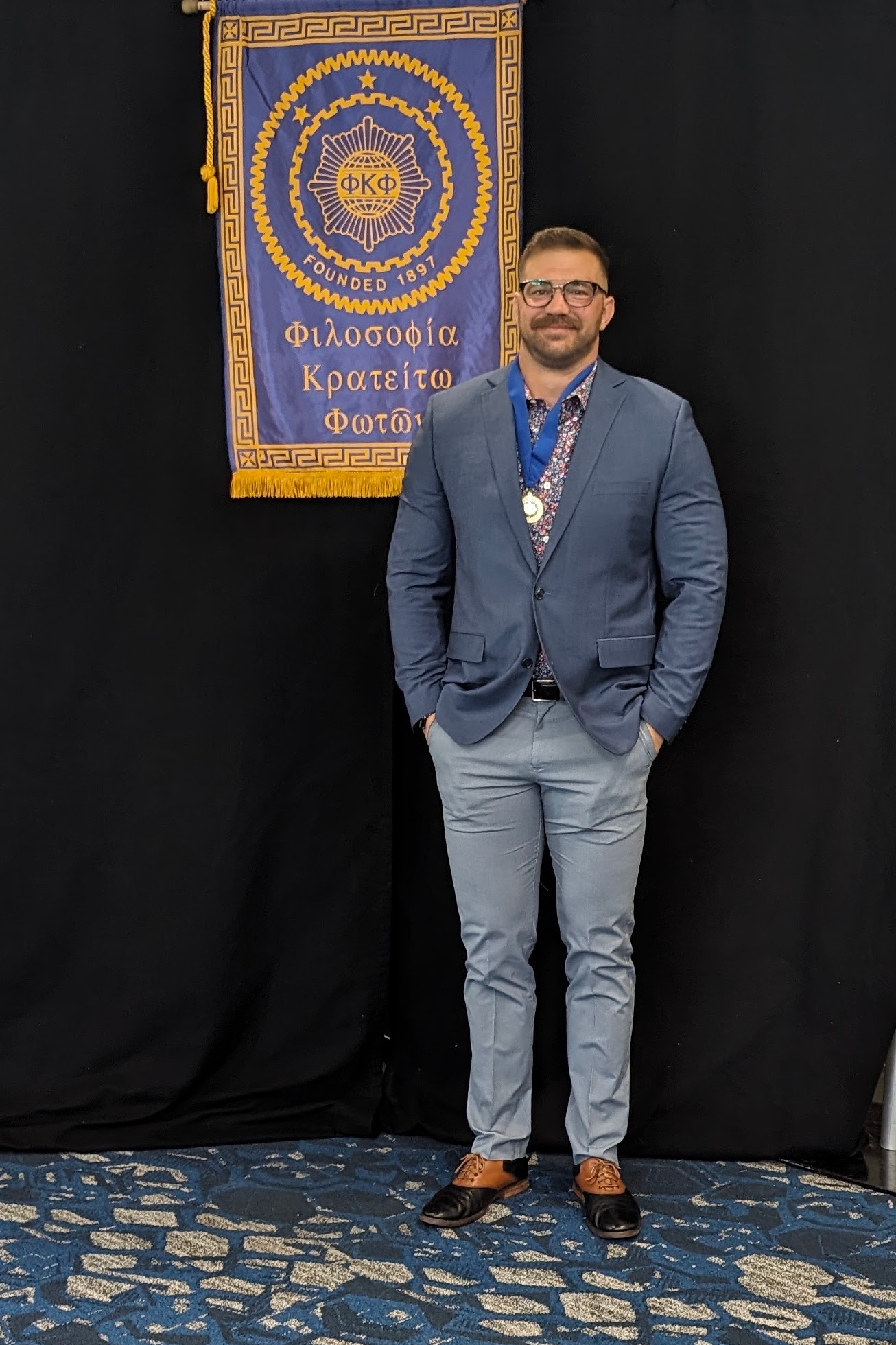 Craig Bolin at Phi Kappa Phi induction, wearing the honor medallion